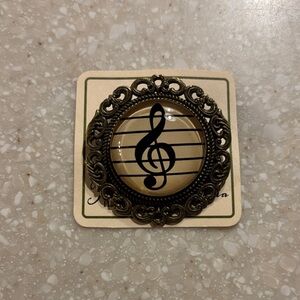 Ornate Black and Gold Musical Brooch